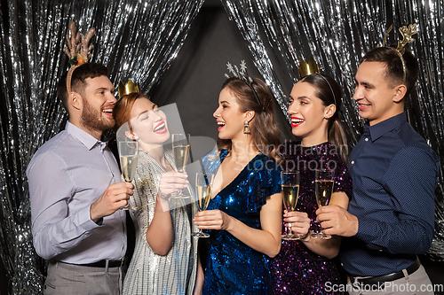 Image of friends with champagne glasses at christmas party