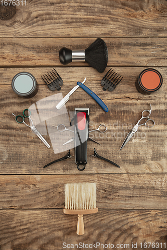 Image of Barber shop equipment set isolated on wooden table background.