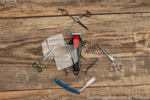 Image of Barber shop equipment set isolated on wooden table background.