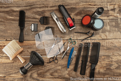 Image of Barber shop equipment set isolated on wooden table background.