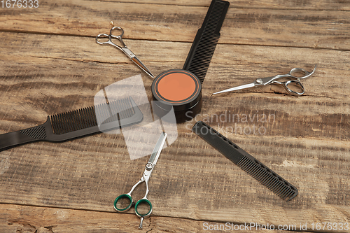 Image of Barber shop equipment set isolated on wooden table background.