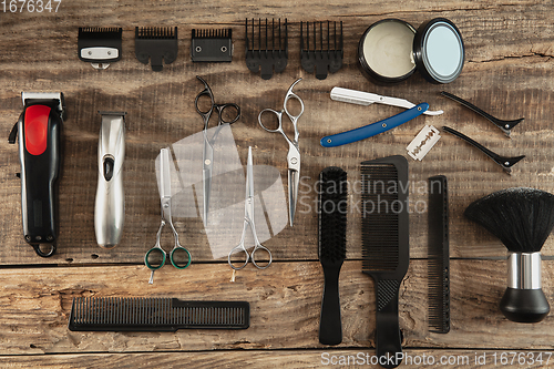 Image of Barber shop equipment set isolated on wooden table background.