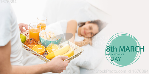 Image of Portrait of young beautiful girl waiting for holiday breakfast. Postcard.