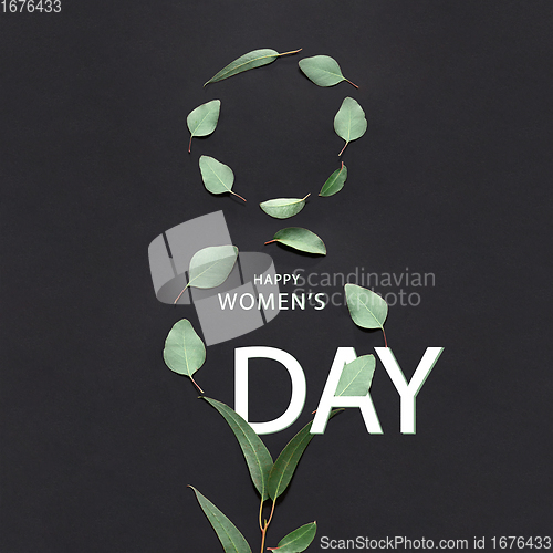 Image of Composition of leaves in shape of number eight 8 over black background.