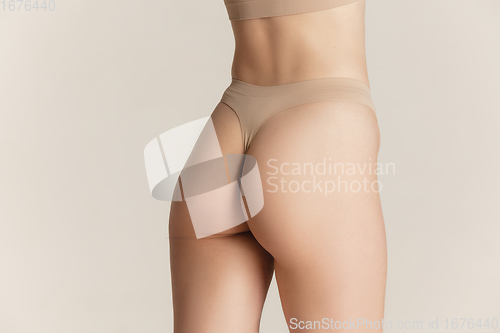 Image of Beautiful female body on white background. Beauty, cosmetics, spa, depilation, diet and treatment, fitness concept.