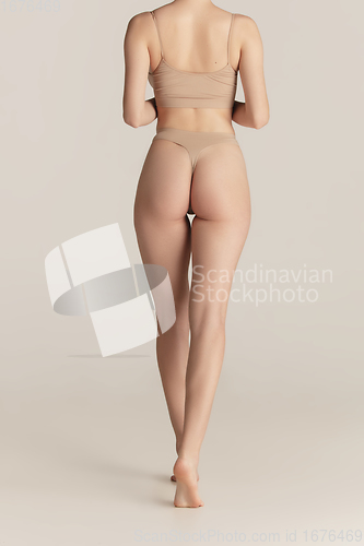 Image of Beautiful female body on white background. Beauty, cosmetics, spa, depilation, diet and treatment, fitness concept.