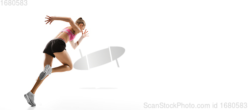 Image of Caucasian professional female runner, athlete training isolated on white studio background. Copyspace for ad.