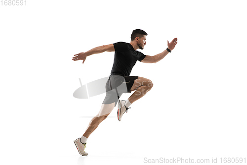 Image of Caucasian professional sportsman training isolated on white studio background. Muscular, sportive man practicing.