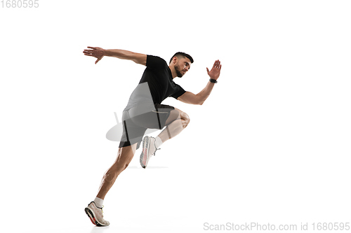 Image of Caucasian professional sportsman training isolated on white studio background. Muscular, sportive man practicing.