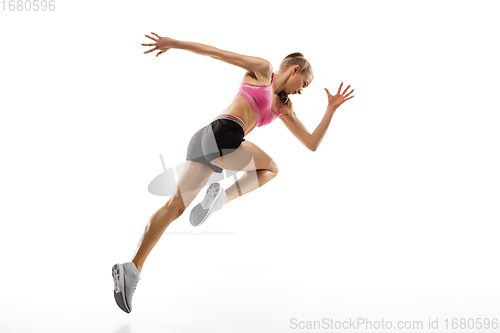Image of Caucasian professional female runner, athlete training isolated on white studio background. Copyspace for ad.