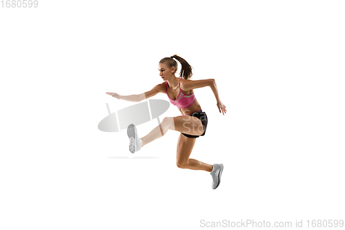 Image of Caucasian professional female runner, athlete training isolated on white studio background. Copyspace for ad.