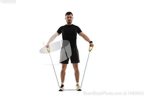 Image of Caucasian professional sportsman training isolated on white studio background. Muscular, sportive man practicing.