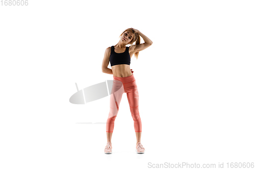 Image of Young caucasian female model in action, motion isolated on white background. Concept of sport, movement, energy and dynamic, healthy lifestyle. Training, practicing.