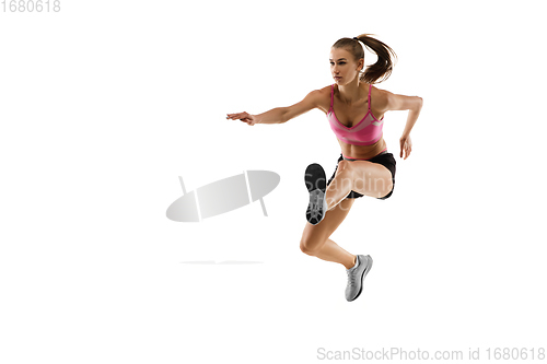 Image of Caucasian professional female runner, athlete training isolated on white studio background. Copyspace for ad.