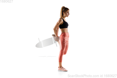 Image of Young caucasian female model in action, motion isolated on white background. Concept of sport, movement, energy and dynamic, healthy lifestyle. Training, practicing.