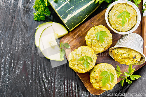 Image of Cupcake with cheese and zucchini on black board top