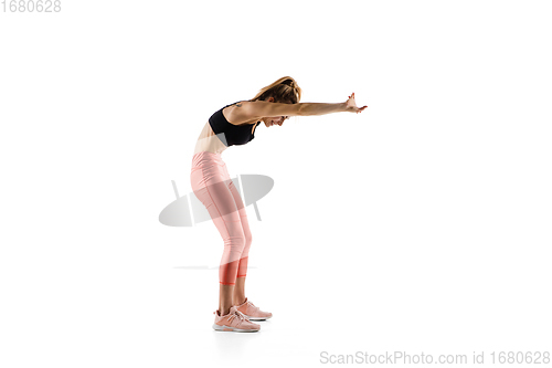 Image of Young caucasian female model in action, motion isolated on white background. Concept of sport, movement, energy and dynamic, healthy lifestyle. Training, practicing.