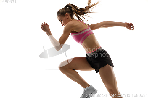 Image of Caucasian professional female runner, athlete training isolated on white studio background. Copyspace for ad.