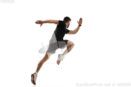 Image of Caucasian professional sportsman training isolated on white studio background. Muscular, sportive man practicing.