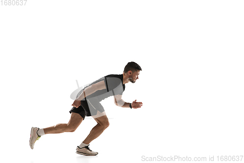 Image of Caucasian professional sportsman training isolated on white studio background. Muscular, sportive man practicing.