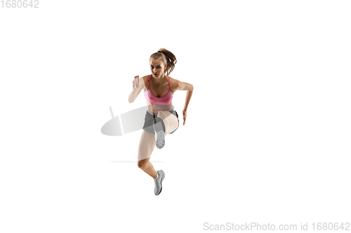 Image of Caucasian professional female runner, athlete training isolated on white studio background. Copyspace for ad.
