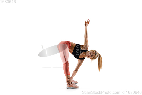 Image of Young caucasian female model in action, motion isolated on white background. Concept of sport, movement, energy and dynamic, healthy lifestyle. Training, practicing.