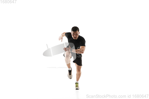 Image of Caucasian professional sportsman training isolated on white studio background. Muscular, sportive man practicing.