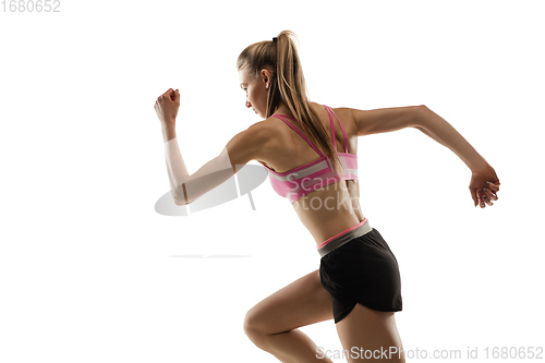 Image of Caucasian professional female runner, athlete training isolated on white studio background. Copyspace for ad.