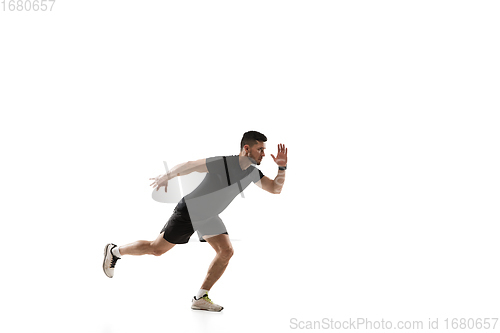 Image of Caucasian professional sportsman training isolated on white studio background. Muscular, sportive man practicing.