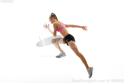 Image of Caucasian professional female runner, athlete training isolated on white studio background. Copyspace for ad.