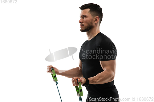 Image of Caucasian professional sportsman training isolated on white studio background. Muscular, sportive man practicing.