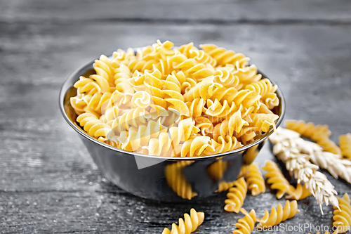 Image of Fusilli whole grain in bowl on board