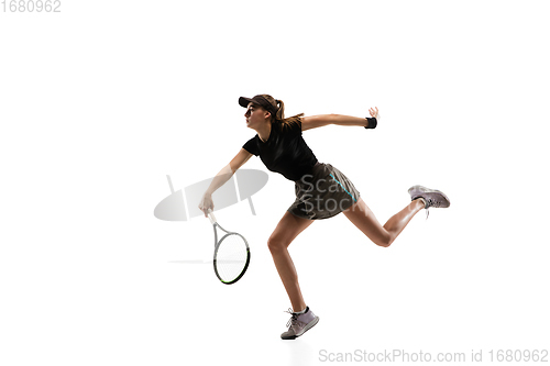 Image of Young caucasian professional sportswoman playing tennis isolated on white background