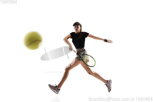 Image of Young caucasian professional sportswoman playing tennis isolated on white background