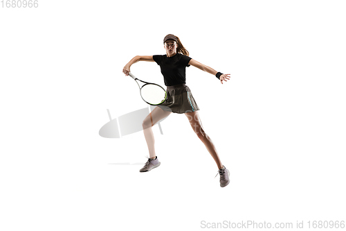 Image of Young caucasian professional sportswoman playing tennis isolated on white background