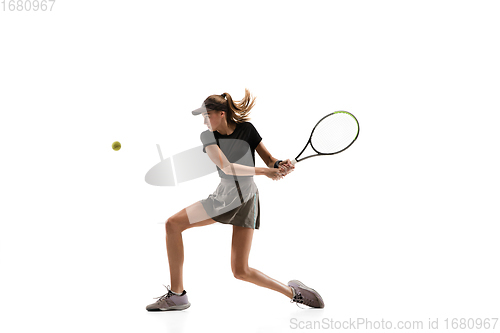 Image of Young caucasian professional sportswoman playing tennis isolated on white background