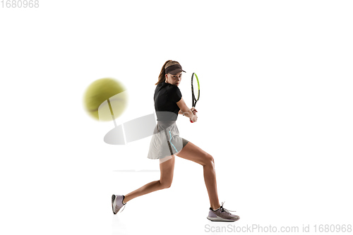 Image of Young caucasian professional sportswoman playing tennis isolated on white background