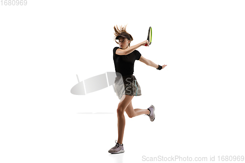 Image of Young caucasian professional sportswoman playing tennis isolated on white background
