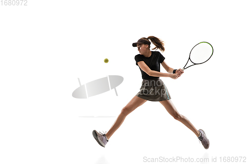 Image of Young caucasian professional sportswoman playing tennis isolated on white background