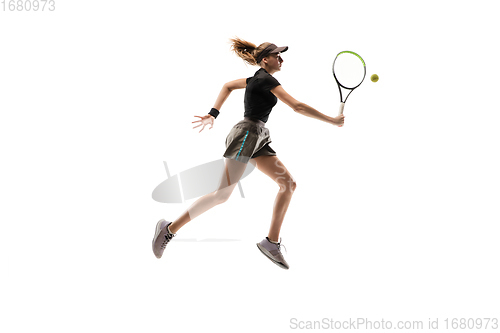 Image of Young caucasian professional sportswoman playing tennis isolated on white background