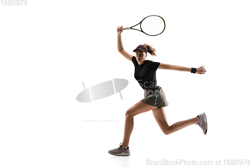 Image of Young caucasian professional sportswoman playing tennis isolated on white background