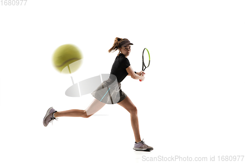 Image of Young caucasian professional sportswoman playing tennis isolated on white background