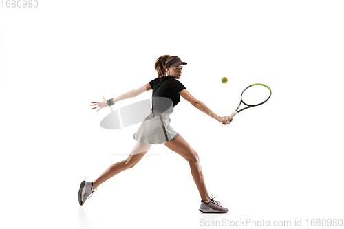 Image of Young caucasian professional sportswoman playing tennis isolated on white background