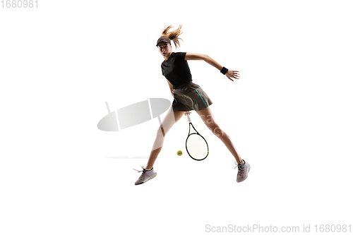 Image of Young caucasian professional sportswoman playing tennis isolated on white background