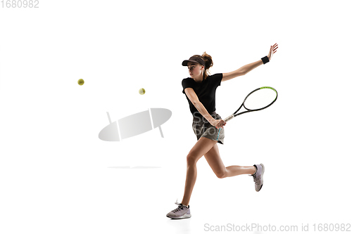 Image of Young caucasian professional sportswoman playing tennis isolated on white background