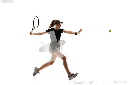 Image of Young caucasian professional sportswoman playing tennis isolated on white background