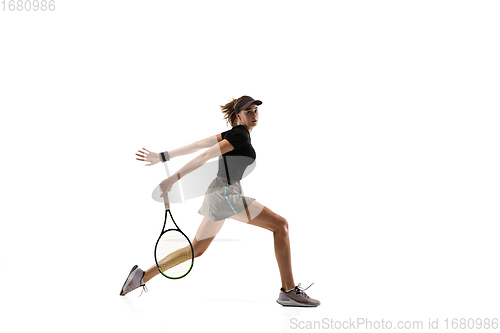 Image of Young caucasian professional sportswoman playing tennis isolated on white background