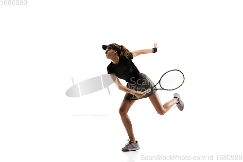 Image of Young caucasian professional sportswoman playing tennis isolated on white background
