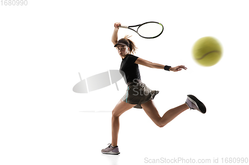 Image of Young caucasian professional sportswoman playing tennis isolated on white background