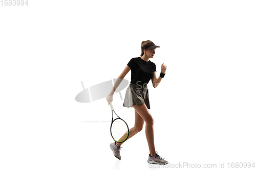 Image of Young caucasian professional sportswoman playing tennis isolated on white background